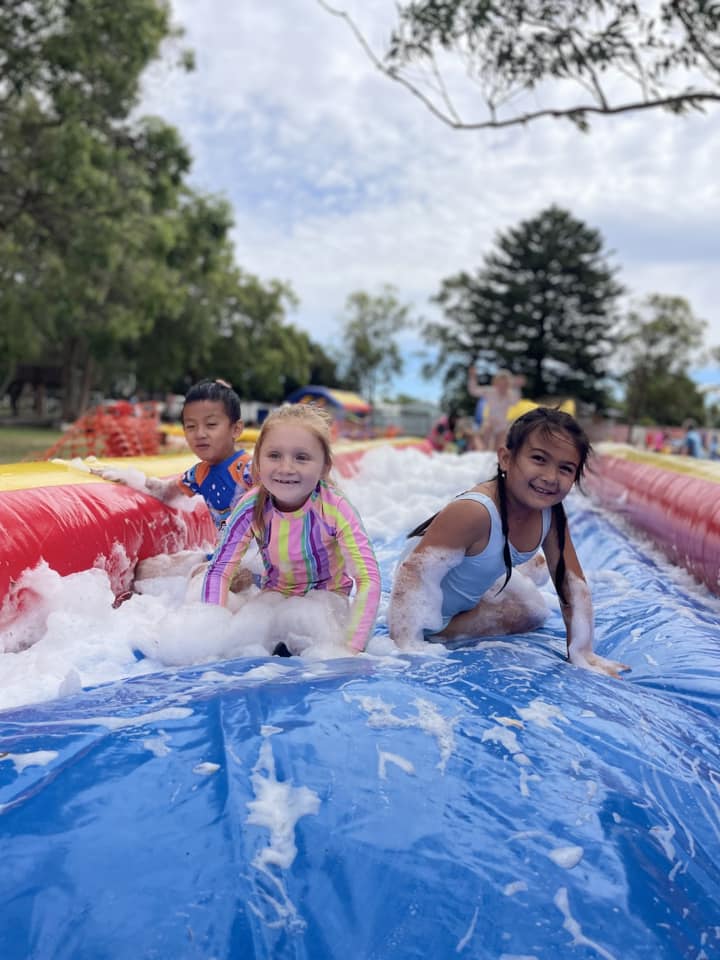 Kids on foam slip n slide
