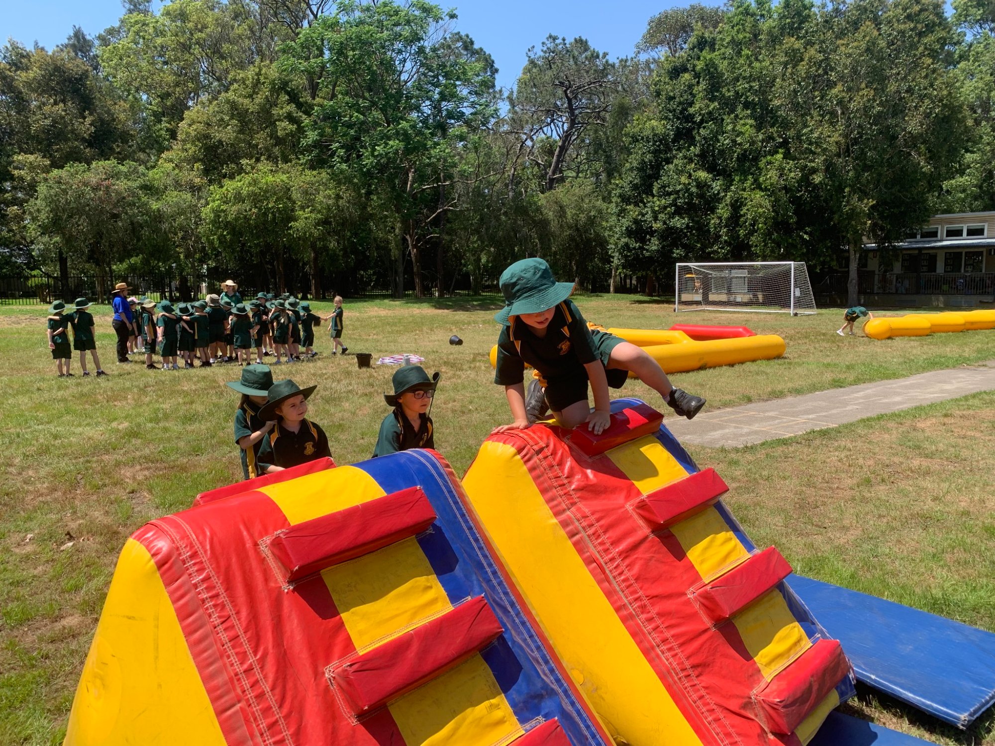 Students on inflatable obstacle course