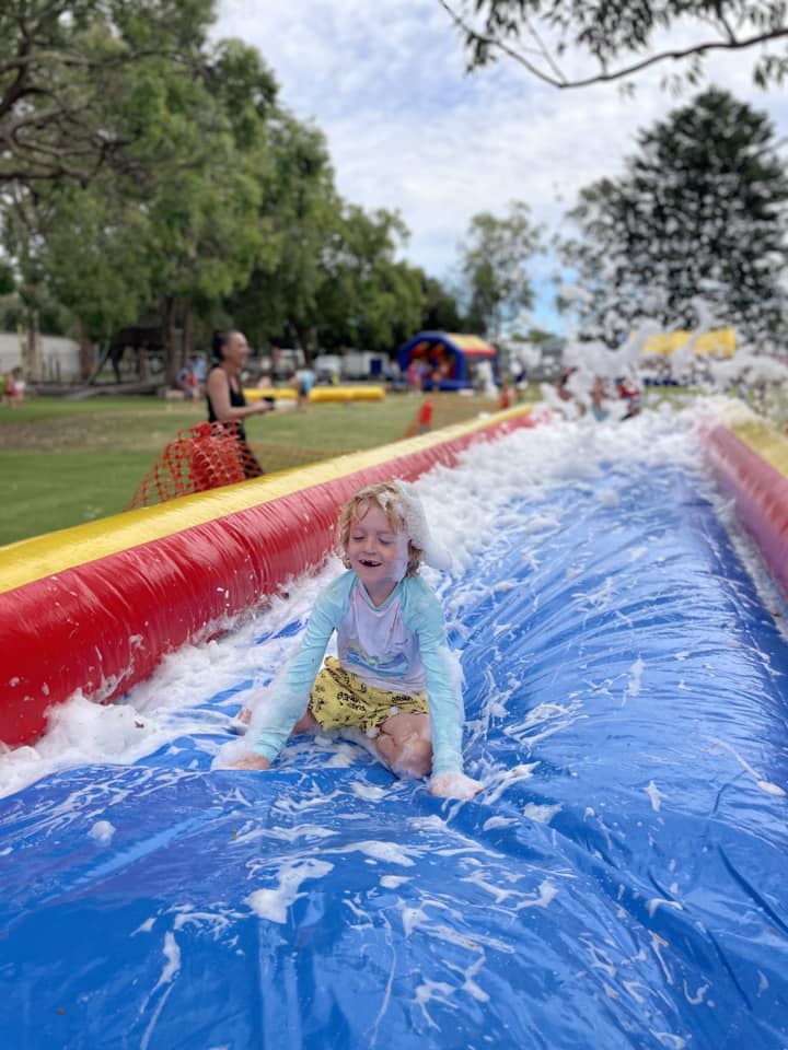 Kids on foam slip n slide
