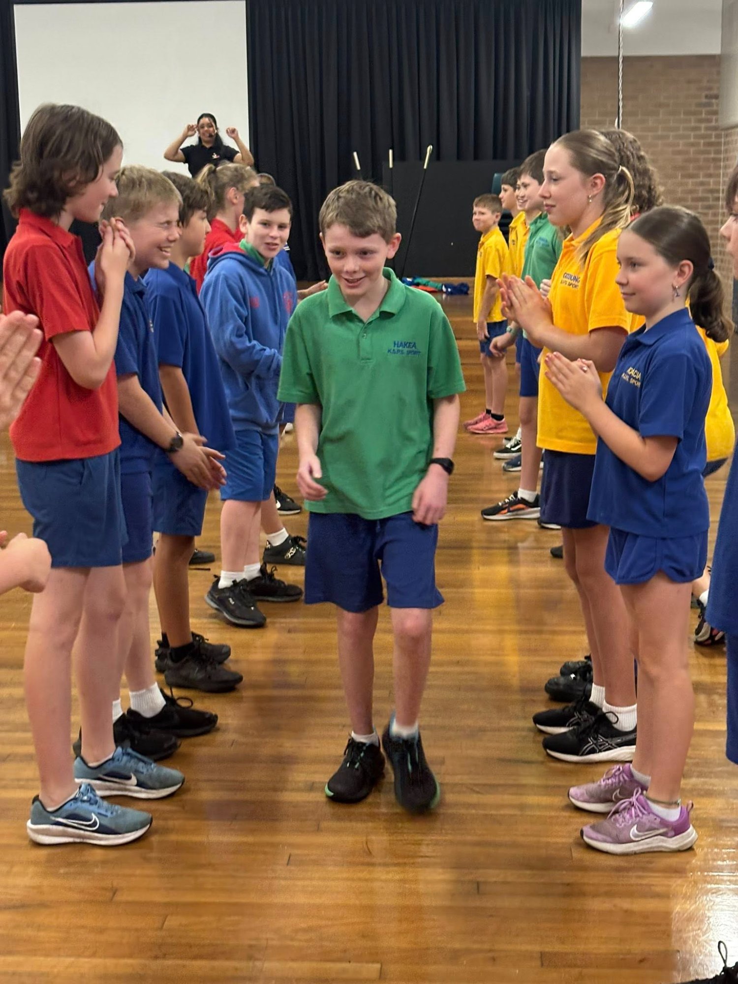 Students dancing in school hall