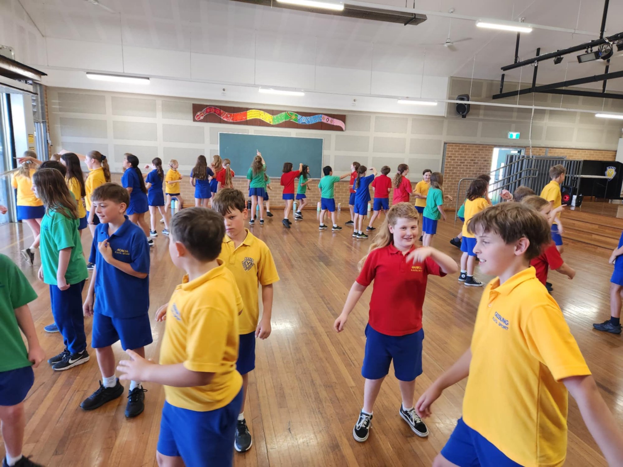 Students dancing in school hall