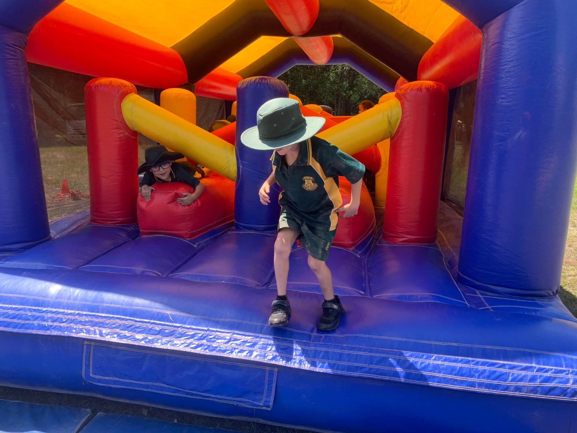 Students on inflatable obstacle course